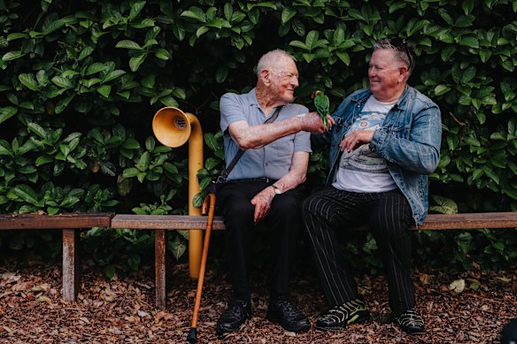 Tom Mehigan, left,  with Jethro Brookes  and lorikeet Rosie.