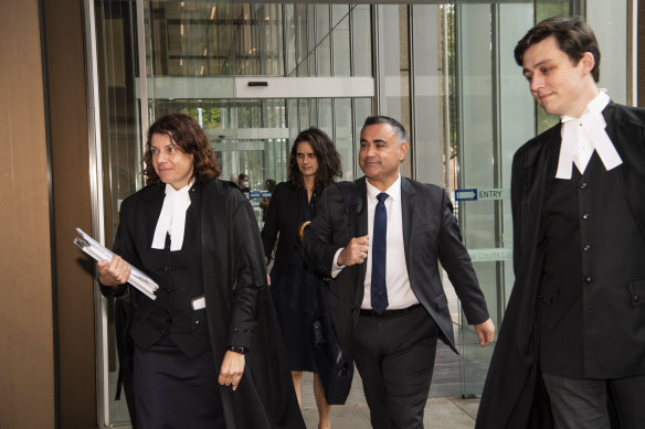 John Barilaro leaves the Federal Court with his lawyers on Thursday.