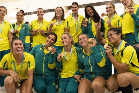 The Australian sevens team have arrived in Sydney after winning Commonwealth Games gold.