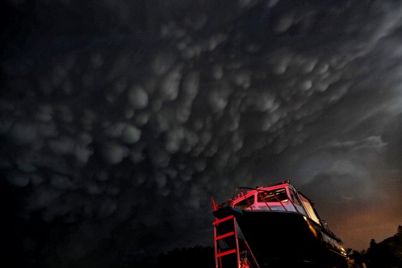 A boat is seen in ambient light as against mammatus clouds associated with more severe storms across Sydney. 