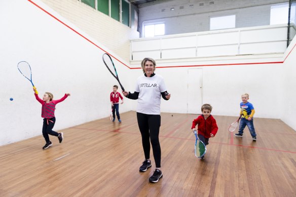 Former squash world champion Michelle Martin with junior players at Warringah Recreation Centre. 