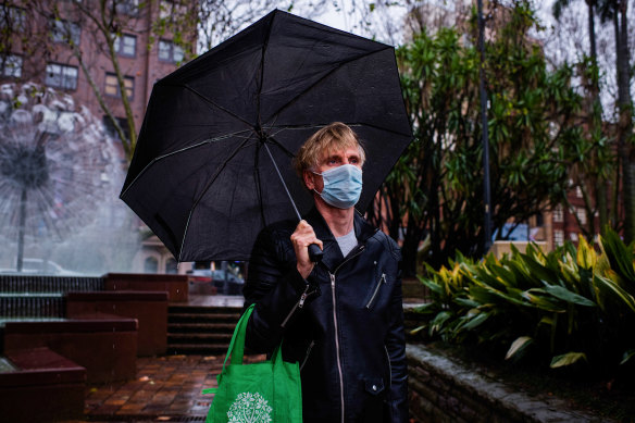 James Adcock and his partner were fined $1000 each for standing up and eating noodles at the Potts Point markets on Saturday.