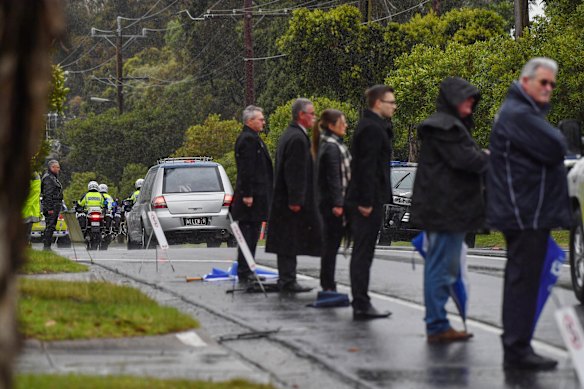 Mourners formed guard of honour in the rain after the funeral for Constable Glen Humphris on Friday.