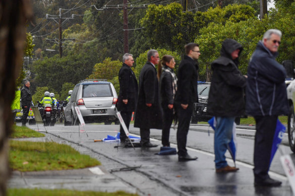 Mourners formed guard of honour in the rain after the funeral for Constable Glen Humphris on Friday.