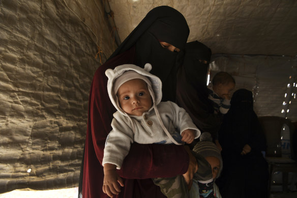 Kirsty Rosse-Emile, 25, holds her two-month-old son Yahya, until this week the youngest Australian detained in al-Hawl camp in the Kurdish-controlled region of Syria.