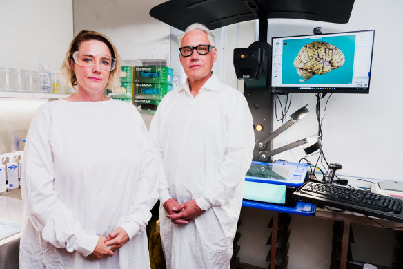 Associate Professor Michael Buckland (right) found the worst case of CTE he had ever seen in the brain of Shane Tuck, former Richmond player and the brother of Renee Tuck (left).