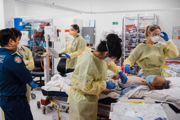 Staff at Concord Repatriation Hospital work on a patient brought in through the emergency department.