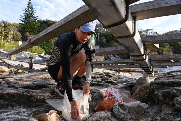 Marina DeBris collects rubbish at Gordons Bay.