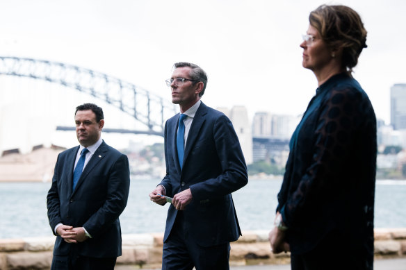 NSW Premier Dominic Perrottet (centre) on Friday.