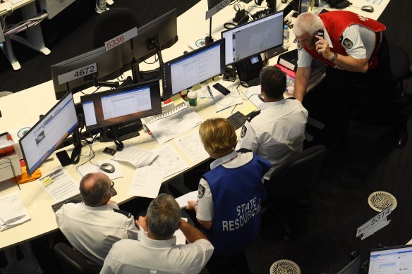 Representatives from dozens of government agencies work to coordinate a response to the NSW bushfires.
