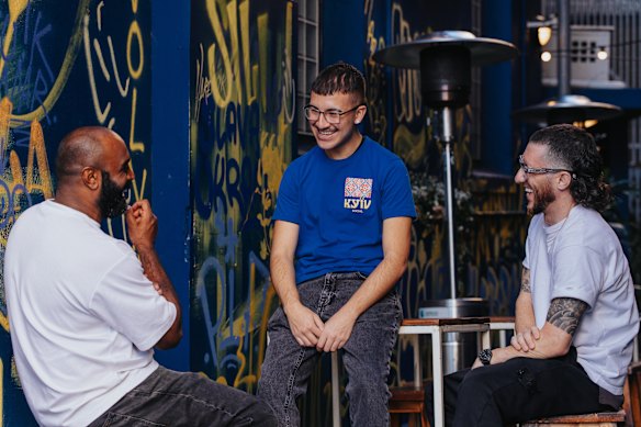 Alexandre Reis (centre), pictured with Shaun David Christie (left) and Mitch Orr (right), twice took part in Second Chance Kitchen, and now works at one of Christie-David’s restaurants while studying. 