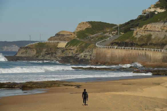 A man on Newcastle Beach during COVID-19 lockdown of the Hunter and Upper Hunter.