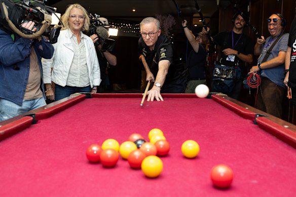 Pool party … Albanese takes the opening shot during a visit to The Paddo to meet with university students, in the electorate of Brisbane.