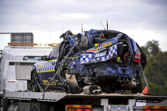 One of the police cars being removed from the scene of the Eastern Freeway crash. 