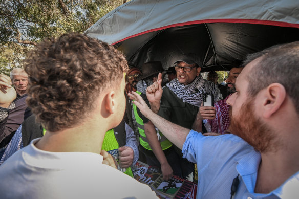 Palestinian and Israeli supporters confront each other at Monash University on Wednesday.