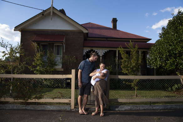 Cameron Cowan, 28, and Jess McAlister, 34, with their eight-week-old daughter Maeve, got into the Orange property market two years ago before house prices skyrocketed.