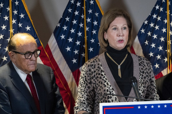 Sidney Powell, right, pictured with Trump's personal lawyer Rudy Giuliani in November.