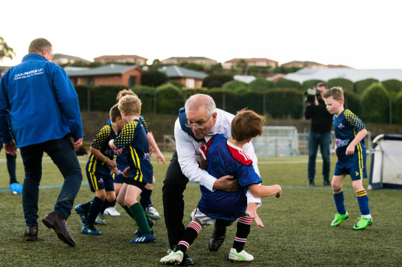 Scott Morrison accidentally tackled a child in the final days of the election campaign in Tasmania.