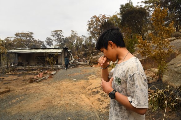 Balmoral resident Gabriel walks around his home during the third visit with his parents. The family remained and attempted to defend their property but conditions became so bad they sheltered in their car that was in their driveway. 