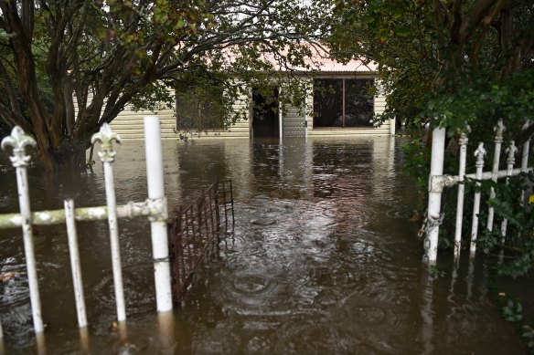A flooded home in Pitt Town, which remains under an evacuation order. 