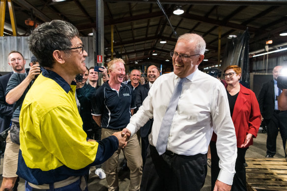 Scott Morrison meets Dindo Suela at Hogan Engineering in western Sydney.