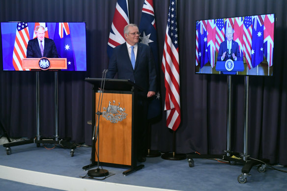 Prime Minister Scott Morrison, US President Joe Biden and British Prime Minister Boris Johnson on Thursday morning, Australian time.