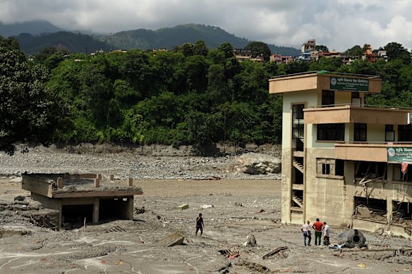 The once-busy town of Dhunge in Nepal has been reduced to a muddy wasteland by the flood.