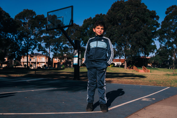 Omar Kahil in 2021. He was gifted a basketball from his parents, but the local court’s hoop had been removed.