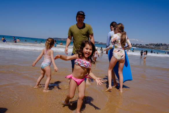 The Murray family enjoying the surf at North Curl Curl Beach on the Labour Day public holiday. 