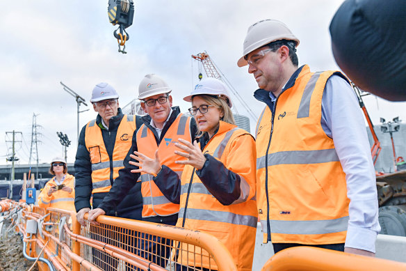 Premier Daniel Andrews (centre), Transport Infrastructure Minister Jacinta Allan (right) and Rail Projects Victoria head Evan Tattersall (left) at the North Melbourne Metro Tunnel site.