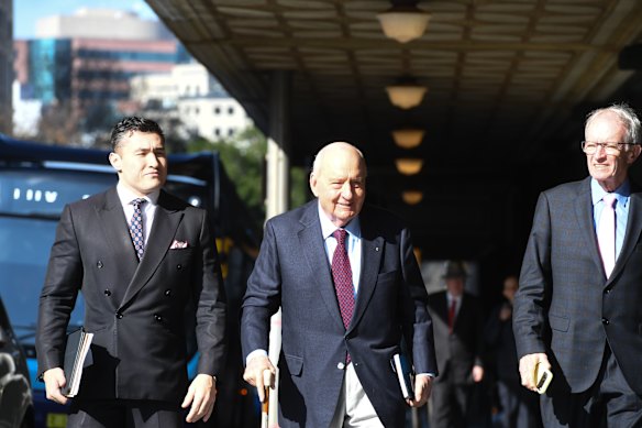 Alan Jones and his legal team on Wednesday.