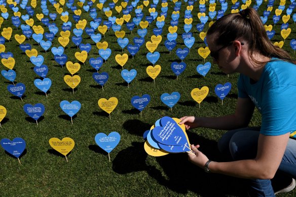 Thousands of hearts with messages of support for voluntary assisted dying legislation in the Domain behind State Parliament in October.