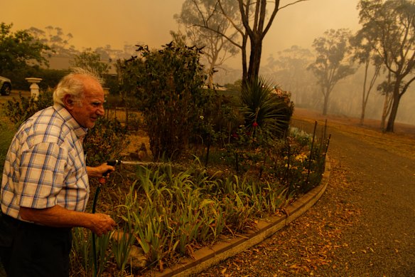 "What do people do in these instances?" Dino Stephanidis waters his wife's roses. 