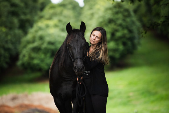 Anna Ludvik with her surviving horse, Willis.