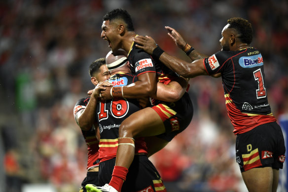 Isaiya Katoa celebrates Mark Nicholls’ try for the Dolphins against the Dragons.