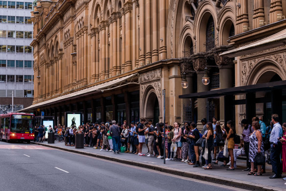 Long lines for buses at the QVB.