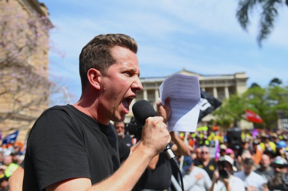 Greens MP Max Chandler-Mather addresses the Brisbane CFMEU rally on Tuesday.