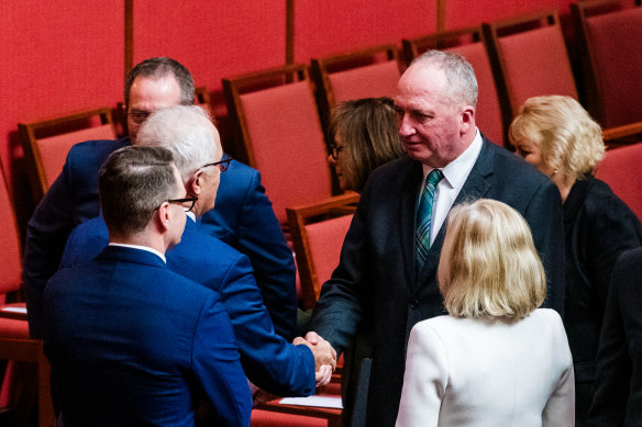 Friends reunited: Malcolm Turnbull (left) shakes hands with Barnaby Joyce. 