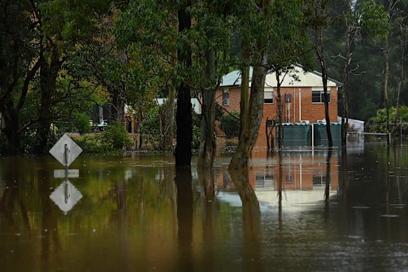 Flooding on the Bucketts Way in South Taree last month. Insurers have already received more than 6000 claims from the recent Mid North Coast disaster.
