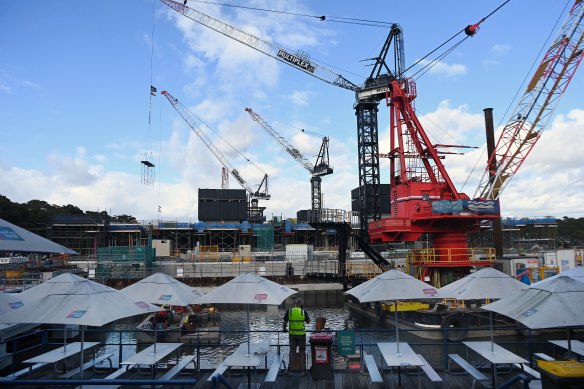 A construction worker looks towards the new Sydney Fish Market.