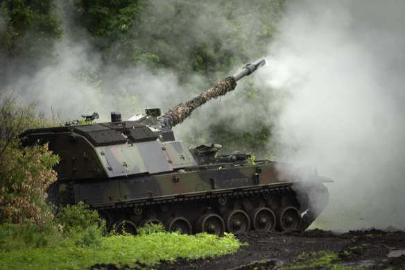 A Ukrainian army, German self-propelled Panzerhaubitze 2000 artillery fires toward Russian positions at the front line near Bakhmut, Donetsk region.