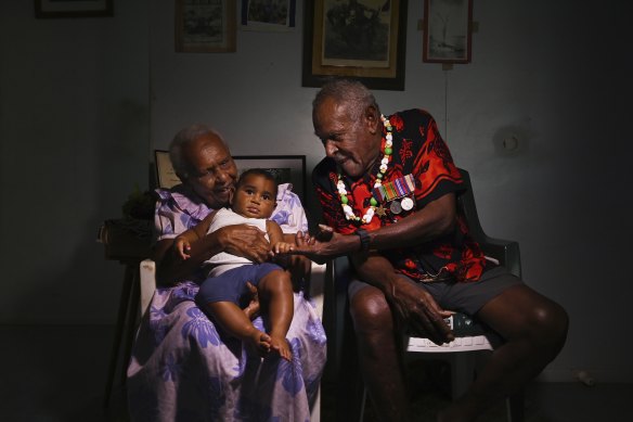 Warusam with his wife Rona, 93, and great-grandchild Masterson Waia aged 5 months old at their home on Saibai Island.