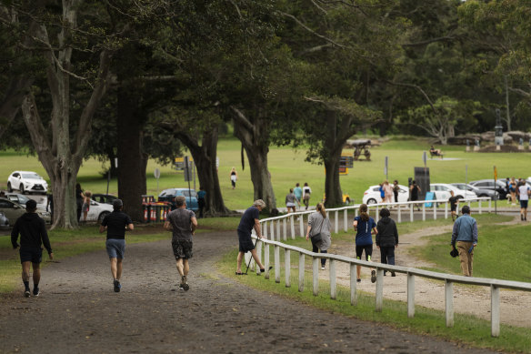 Runners and walkers in Centennial Park last week.