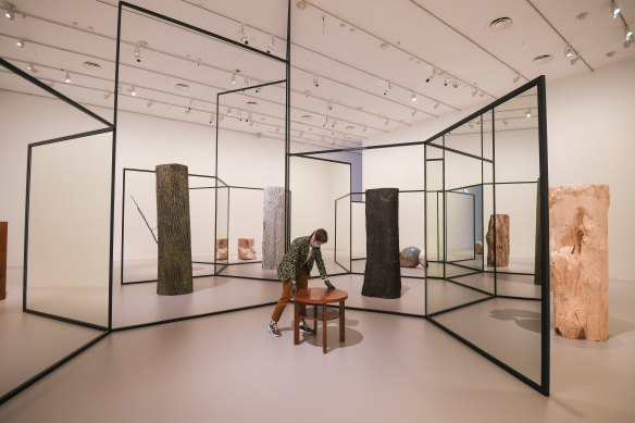 Installation project manager Nadya Sinyutina with artist Alicja Kwade's installation "WeltenLinie" at the NGV. 