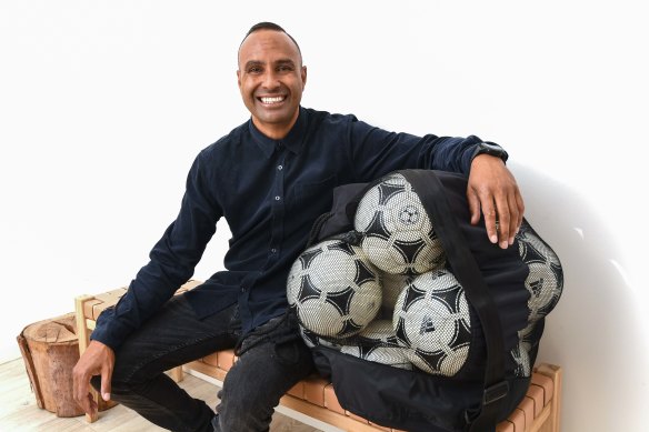 Former Socceroo Archie Thompson on Friday, with 13 soccer balls, representing the 13 goals he scored against American Samoa in a world record in 2001.