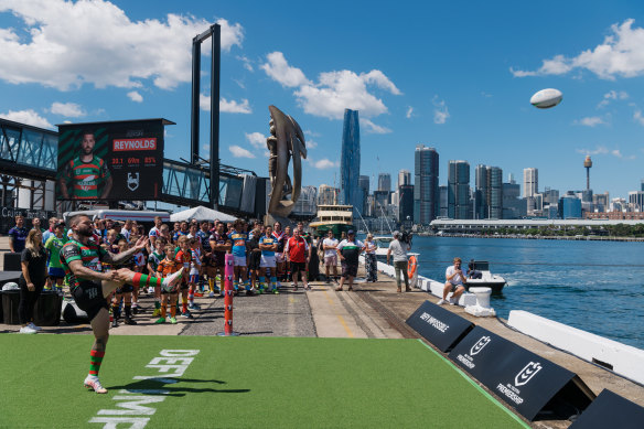 Adam Reynolds launches a kick at the 2021 NRL launch at White Bay Cruise Terminal.