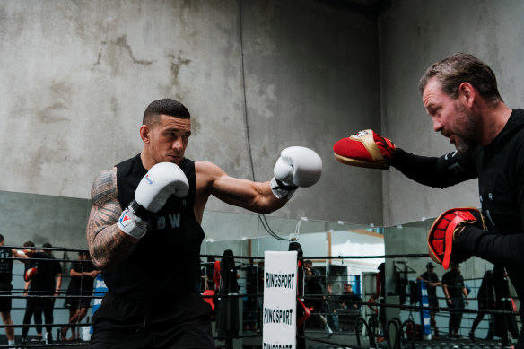 Sonny Bill Williams works out with trainer Andy Lee.