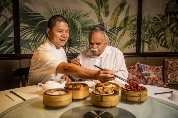 Chinese migrant Stevenson Su and Aboriginal elder Steve Widders share lunch at Mr Su's restaurant in Canley Vale. Both took part in the National Australia Day Council's new campaign.