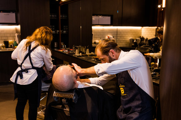 Barber Elvis Jones, from Barberhood in Martin Place, where bookings are down this week despite the proclaimed return to the CBD.