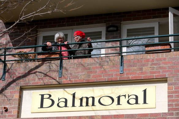 Residents of the Balmoral Apartment complex in Hawthorn on Friday.